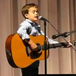 (VIDEO)2nd grader grabs his guitar and blows away the house with a Johnny Cash classic