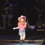 (VIDEO)Little Cowgirl Begins Singing, Then She Puts A Special Country Twist On The Song That Has Crowd Going Crazy