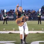 (VIDEO) Because no one wanted to sing the national anthem, one high school kid removed his helmet and picked up a guitar.