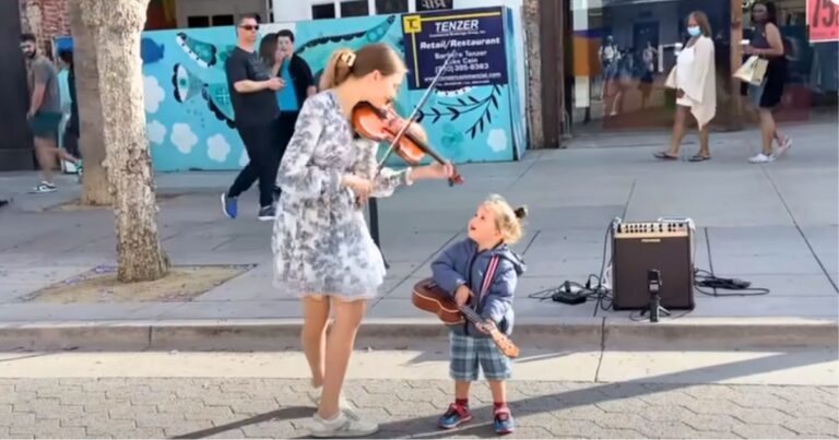 Violin prodigy begins playing Beatles classic but then toddler hops in and steals show