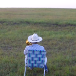 (VIDEO)A Farmer Takes a Seat in an Empty Field and Starts Playing Trombone, But Look Who Comes Running To Enjoy His Music