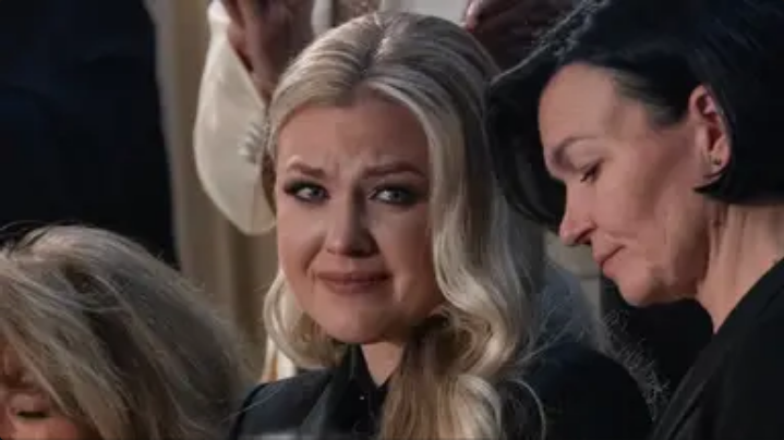 Three word phrase mouthed by Erika Kirk as she was being mentioned by Trump in State of the Union speech