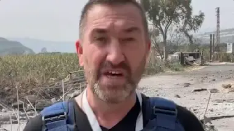 Terrifying moment British journalist is hit by missile while filming report